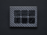 Retouched carbon fiber case preview on charcoal; see original photo for exact finish